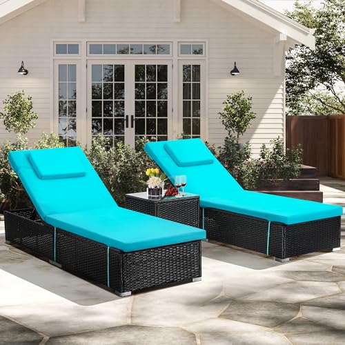 Poolside chaise lounges and side table arranged as a coordinated outdoor lounging zone.