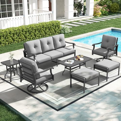 Poolside outdoor furniture set with seating, table and cushions arranged for a backyard pool deck.